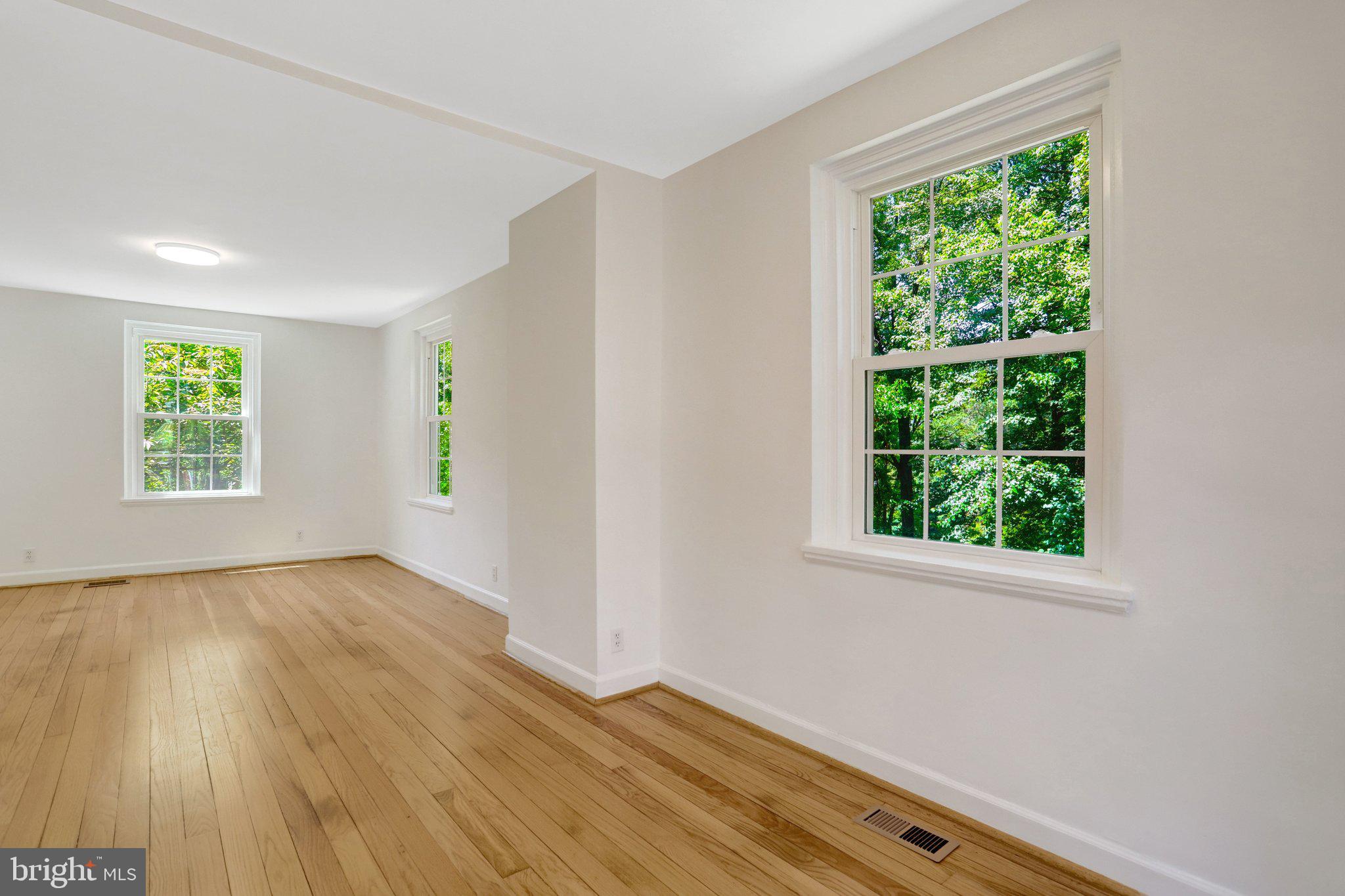 4837 27th Road South Arlington, VA 22206 - Photo 7 of 34 a view of an empty room with wooden floor and a window