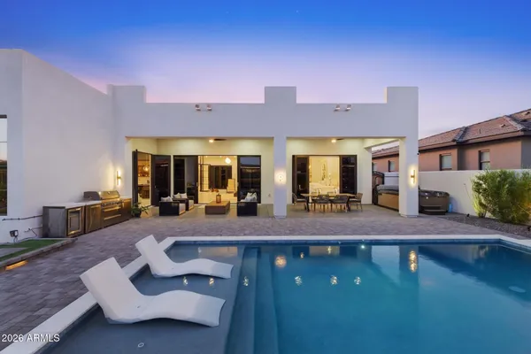 a view of a patio with couches chairs and potted plants