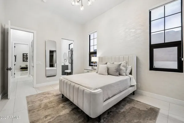 a bathroom with a sink mirror and toilet