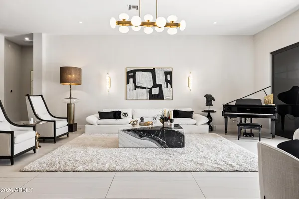 a living room with furniture cabinets and a table