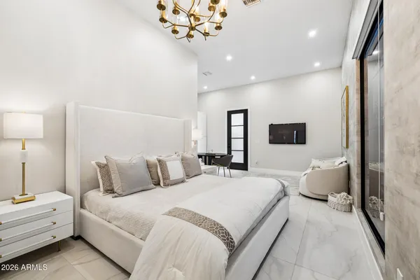 a living room with stainless steel appliances kitchen island granite countertop a couch a dining table and chairs