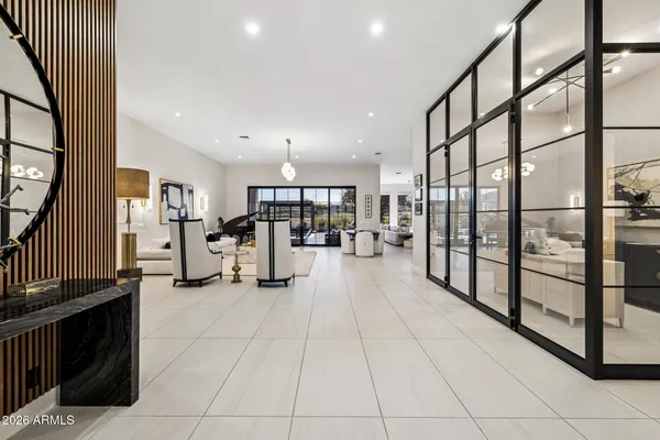 a kitchen with a sink and white cabinets