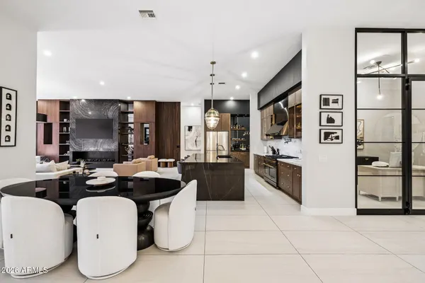 a kitchen with stainless steel appliances a sink stove and refrigerator