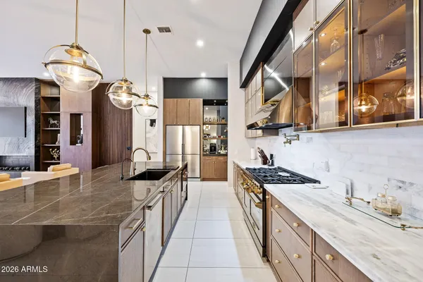 a stove top oven sitting inside of a kitchen