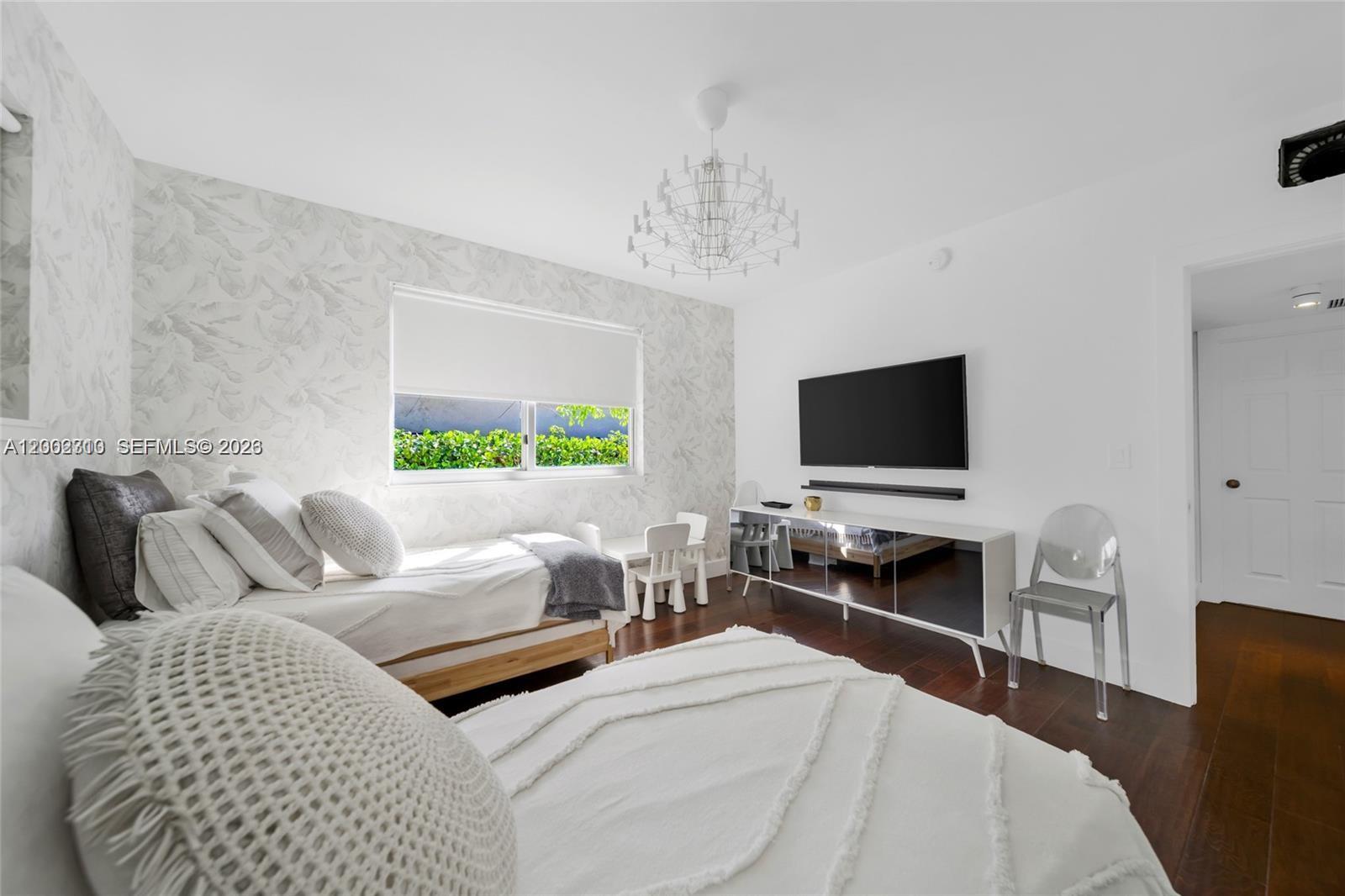 3531 Southwest 1st Avenue Miami, FL 33145 - Photo 13 of 44 a living room with furniture and a flat screen tv