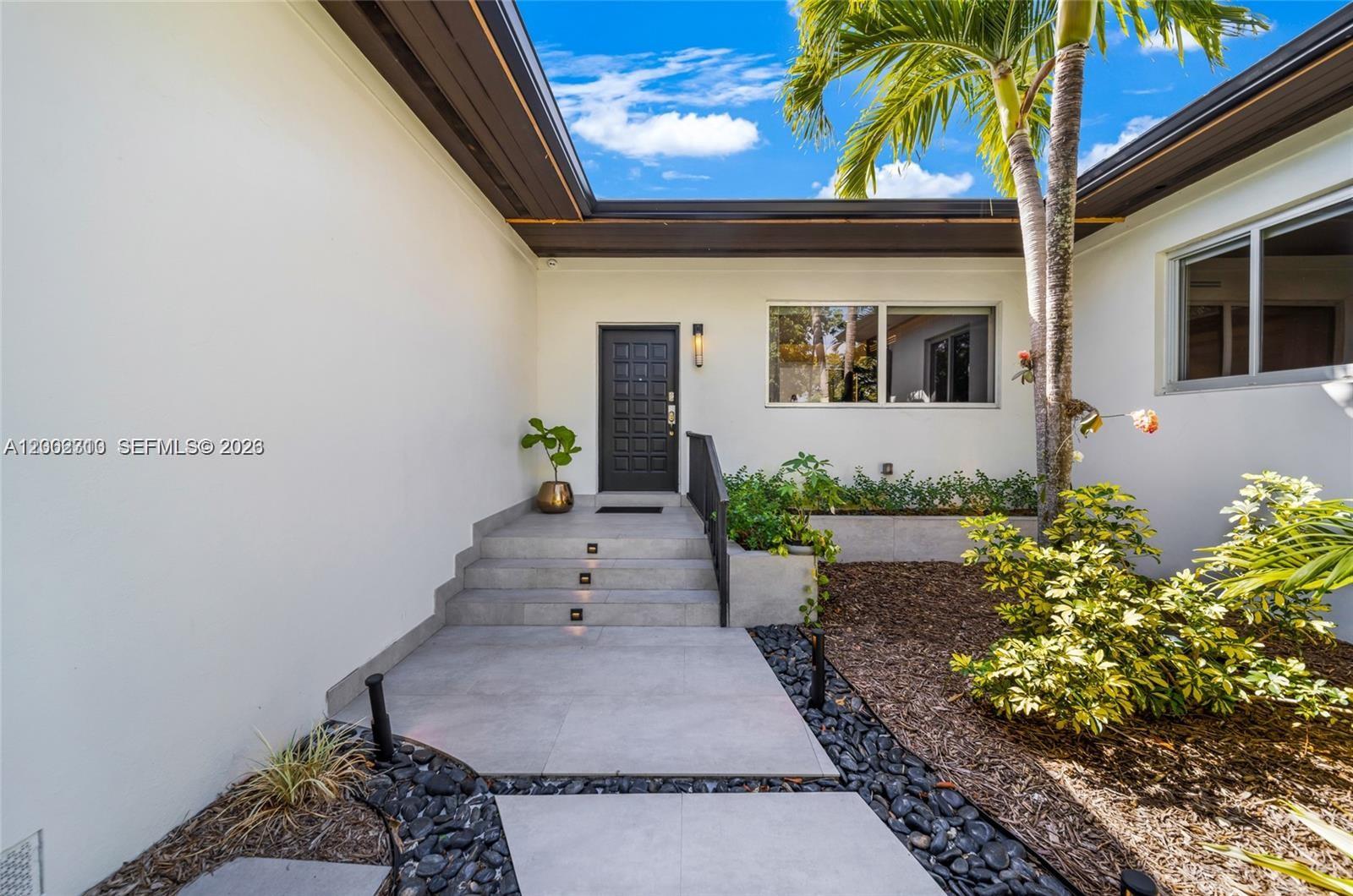 3531 Southwest 1st Avenue Miami, FL 33145 - Photo 19 of 44 a front view of a house with entryway