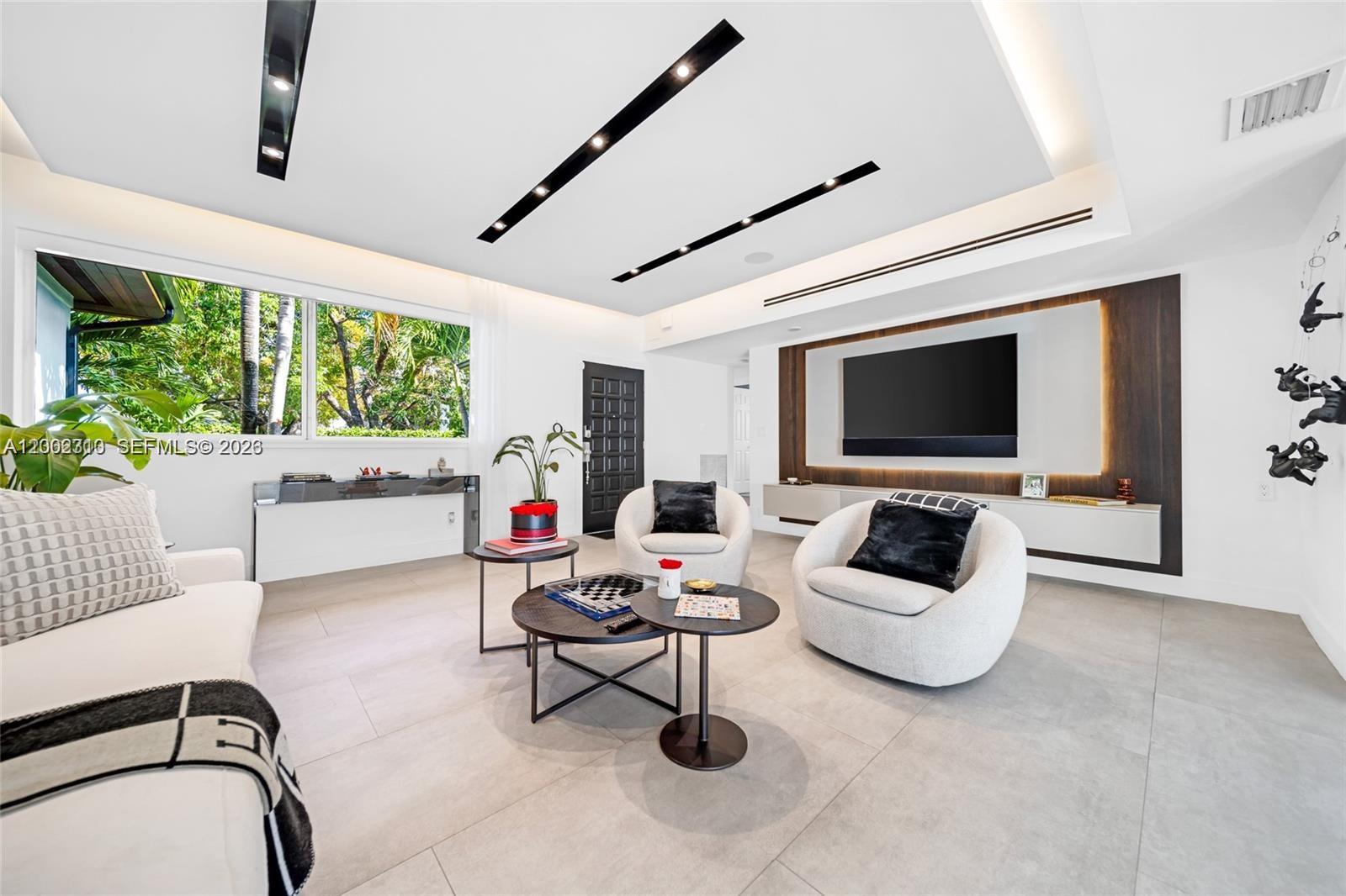 3531 Southwest 1st Avenue Miami, FL 33145 - Photo 20 of 44 a living room with furniture and a flat screen tv