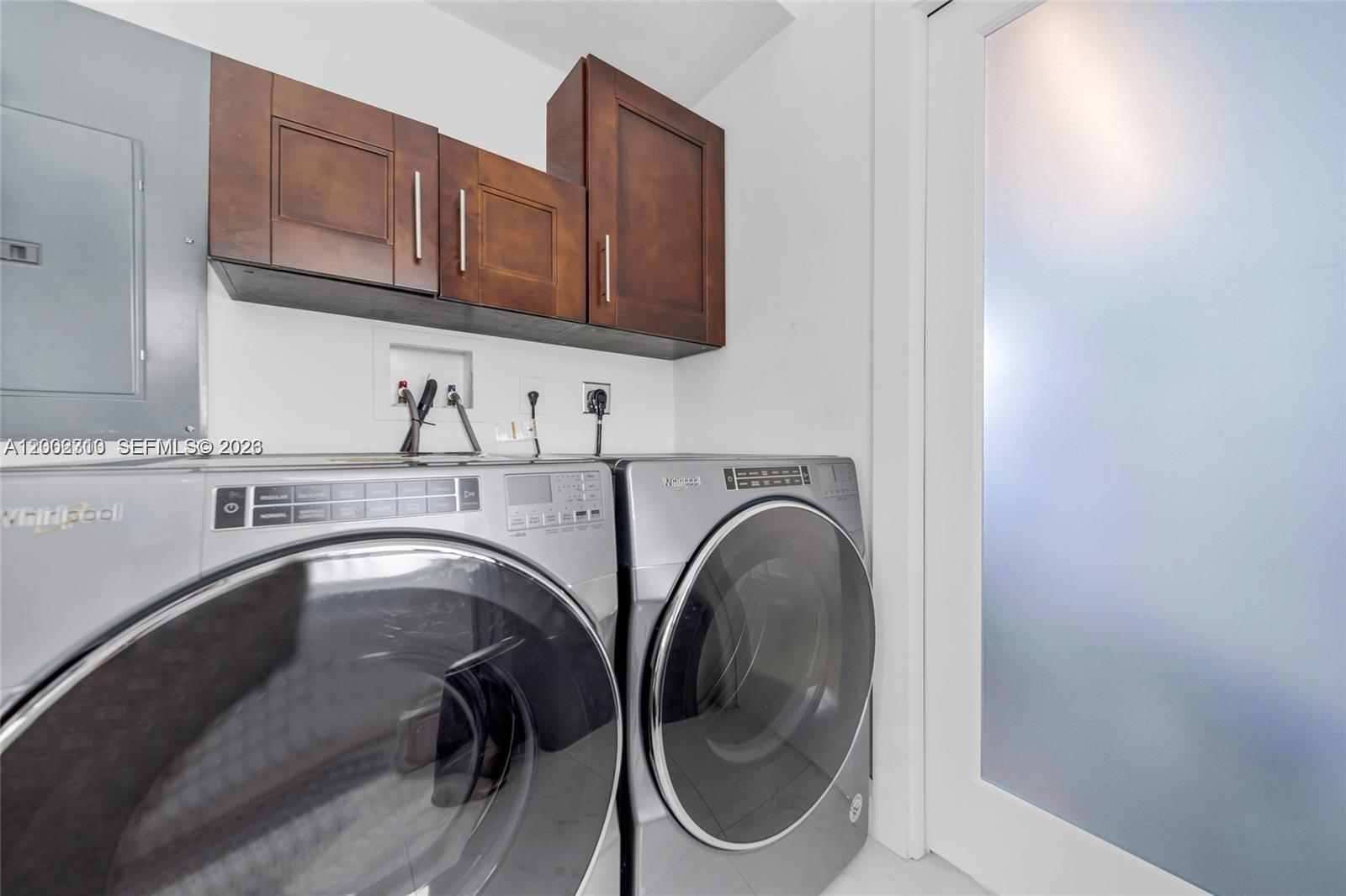 3531 Southwest 1st Avenue Miami, FL 33145 - Photo 21 of 44 a kitchen with a sink a washer and dryer