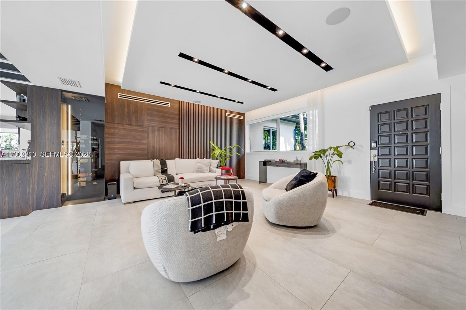 3531 Southwest 1st Avenue Miami, FL 33145 - Photo 23 of 44 a living room with furniture and white walls