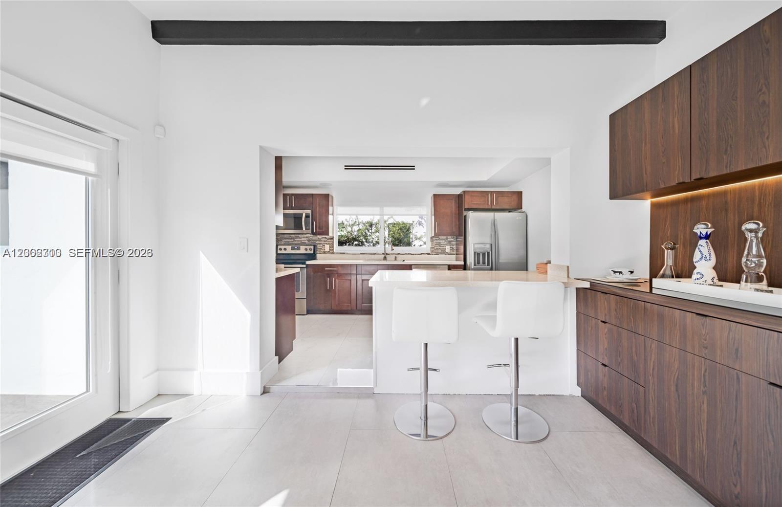 3531 Southwest 1st Avenue Miami, FL 33145 - Photo 24 of 44 a kitchen with a sink cabinets and window