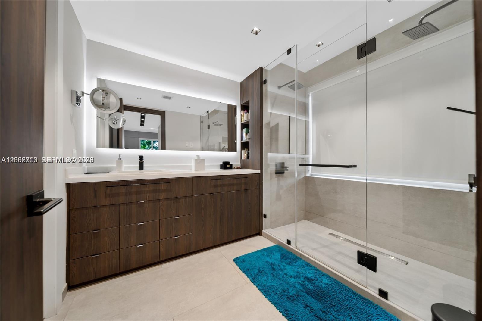 3531 Southwest 1st Avenue Miami, FL 33145 - Photo 26 of 44 a spacious bathroom with a double vanity sink a large mirror and shower