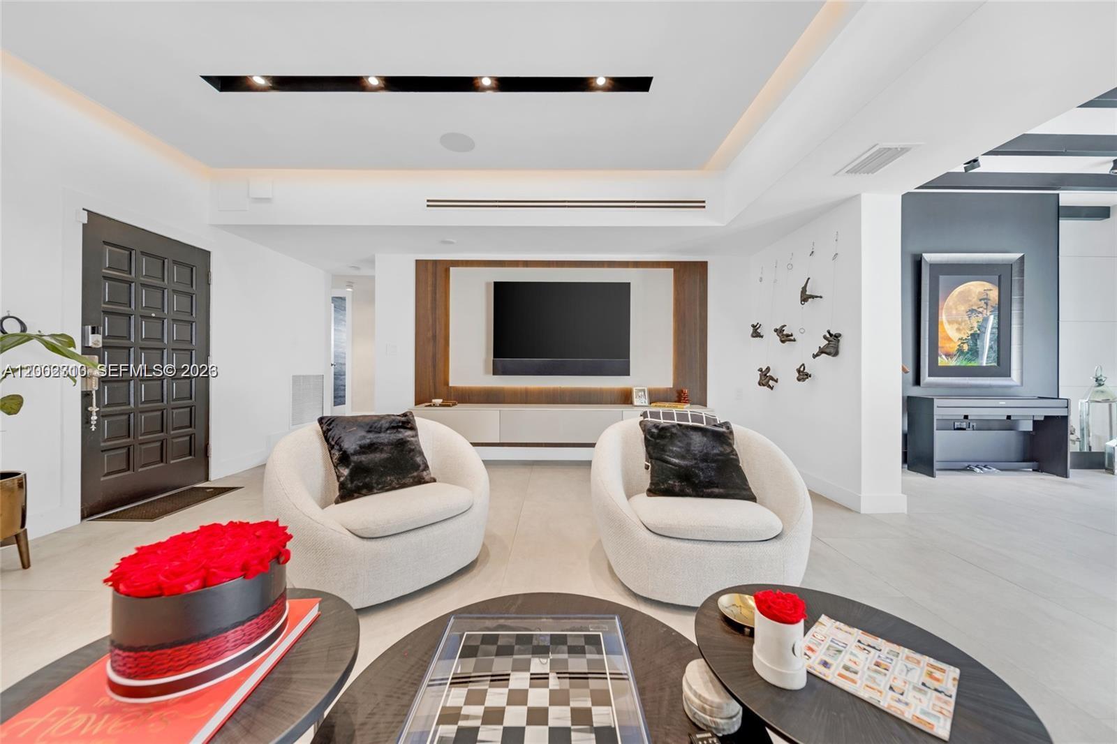 3531 Southwest 1st Avenue Miami, FL 33145 - Photo 27 of 44 a living room with furniture and a fireplace