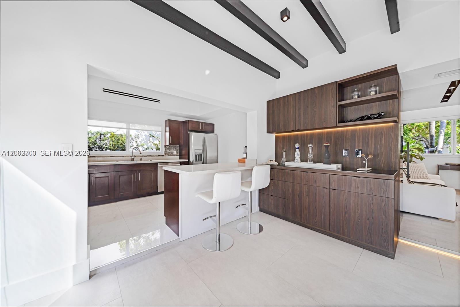 3531 Southwest 1st Avenue Miami, FL 33145 - Photo 30 of 44 a kitchen with a sink a counter space and cabinets