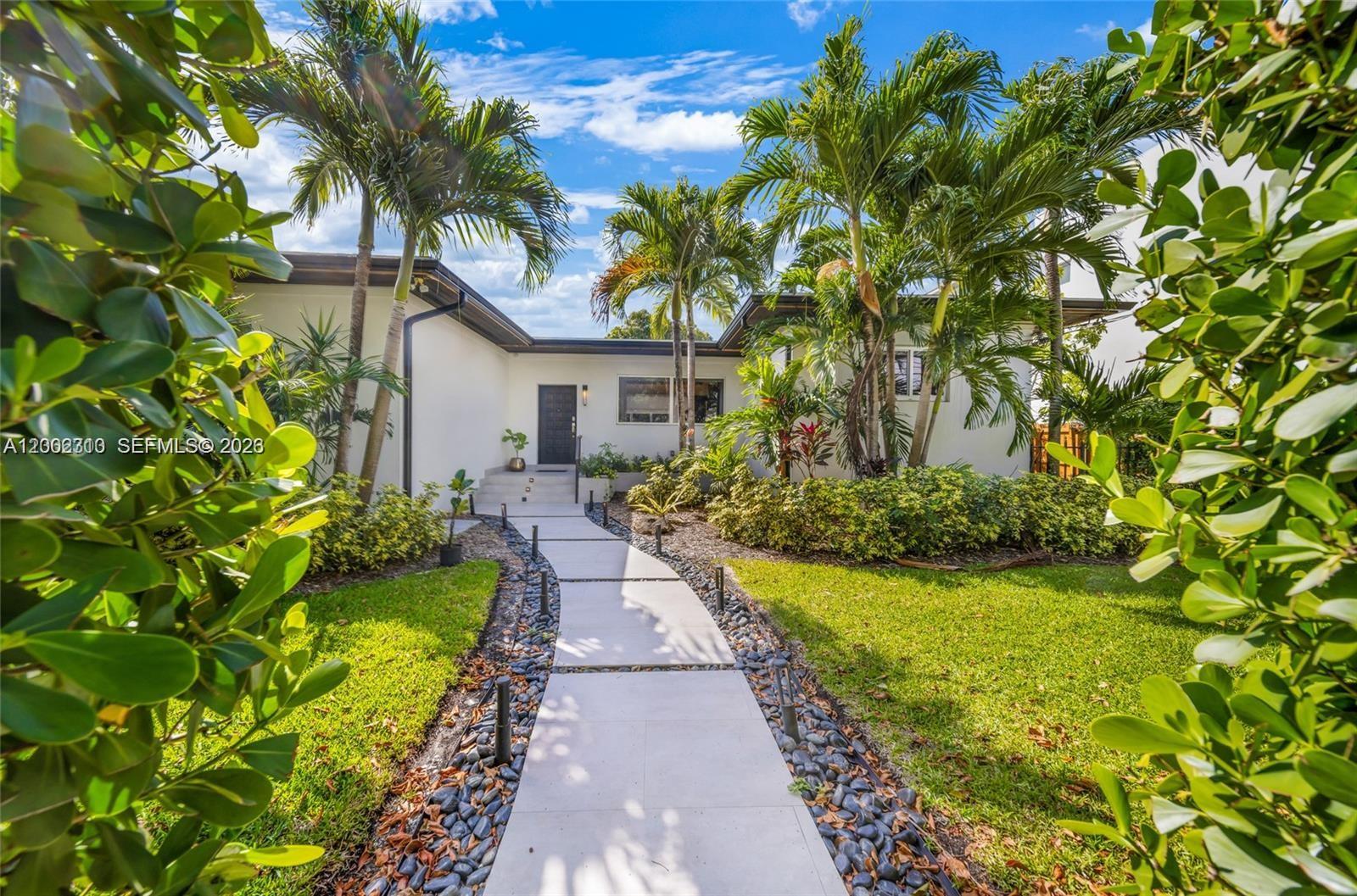 3531 Southwest 1st Avenue Miami, FL 33145 - Photo 3 of 44 a view of a house with a yard and garden