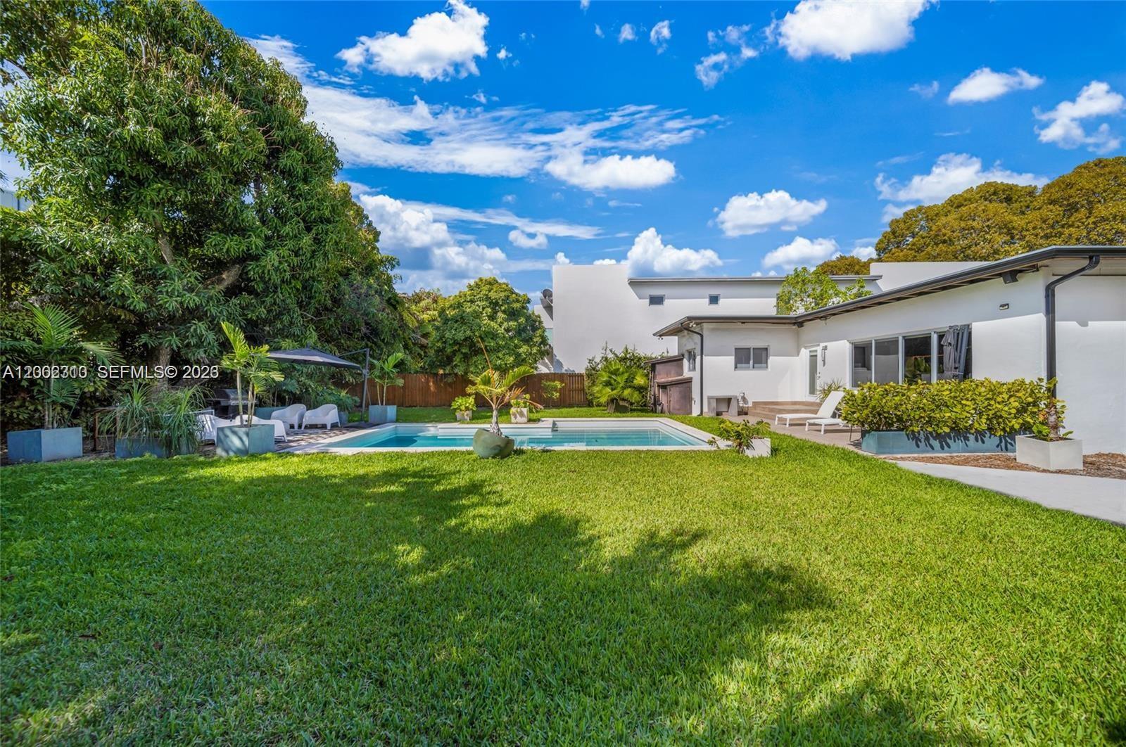 3531 Southwest 1st Avenue Miami, FL 33145 - Photo 37 of 44 a front view of a house with a yard