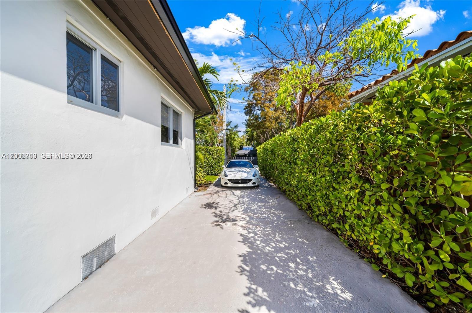 3531 Southwest 1st Avenue Miami, FL 33145 - Photo 43 of 44 a pathway of a house with a yard and garden