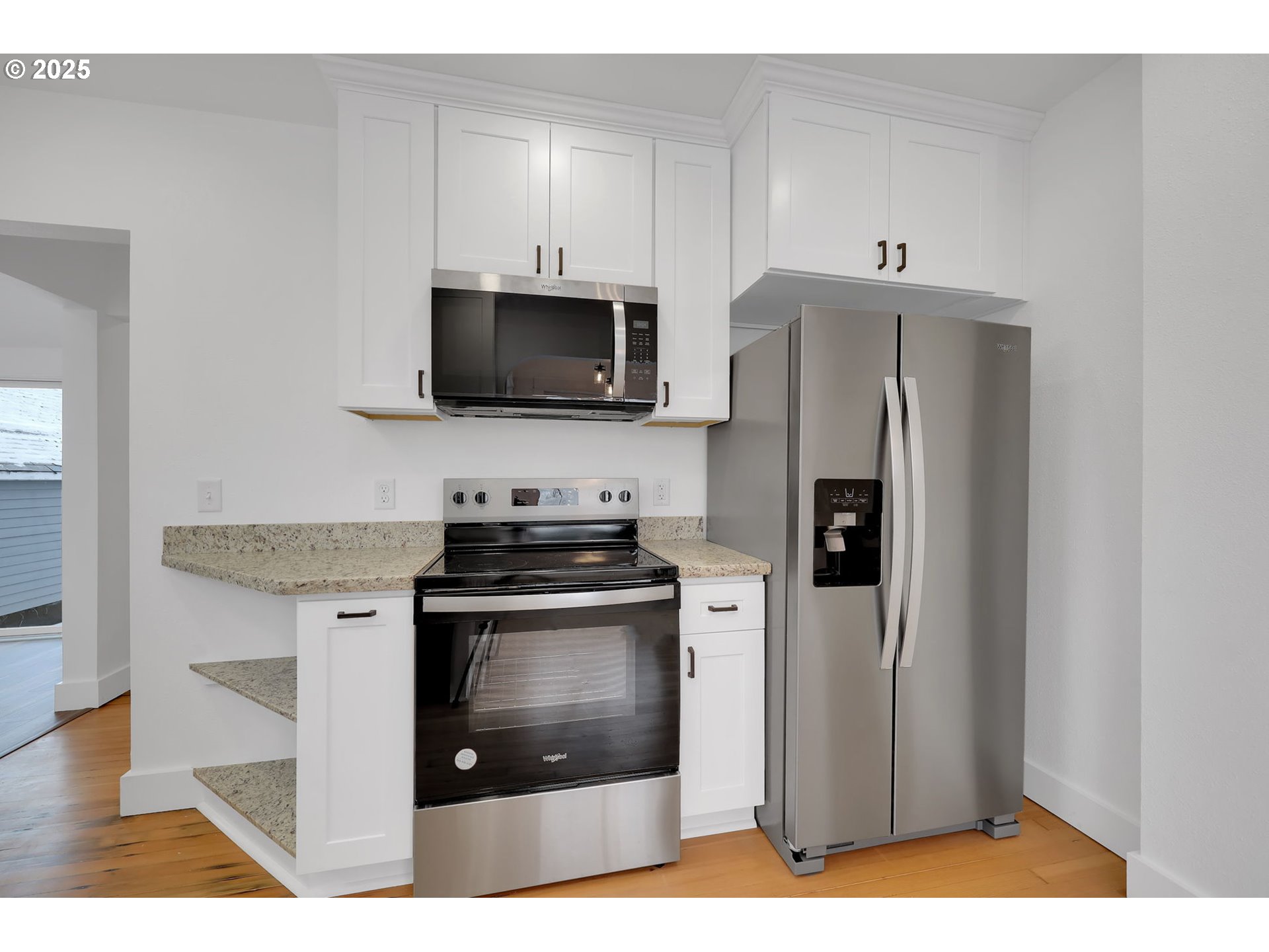 92910 River Road Junction City, OR 97448 - Photo 13 of 43 a kitchen with stainless steel appliances a stove microwave and refrigerator