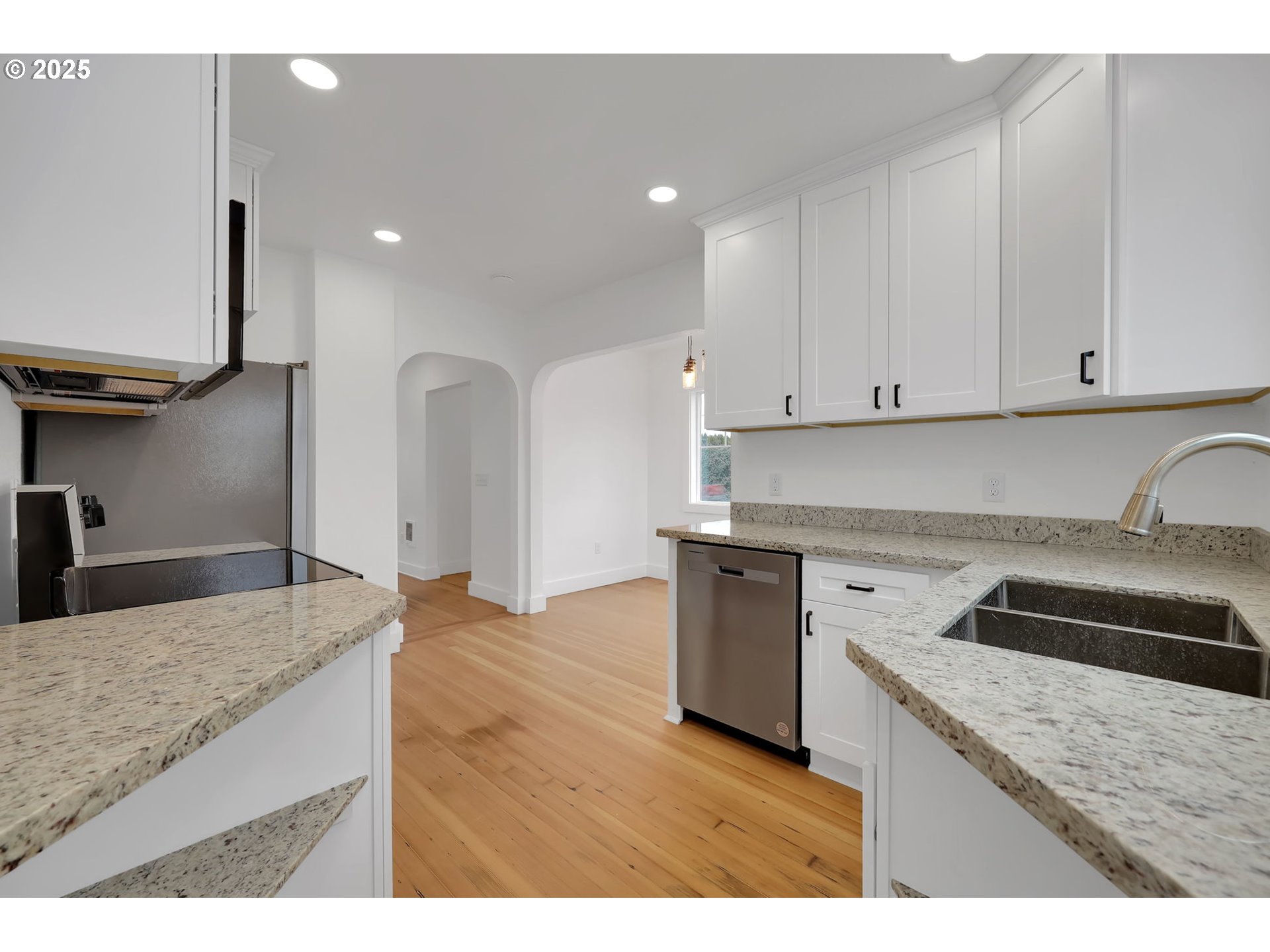 92910 River Road Junction City, OR 97448 - Photo 14 of 43 a kitchen with granite countertop a sink and a stove top oven