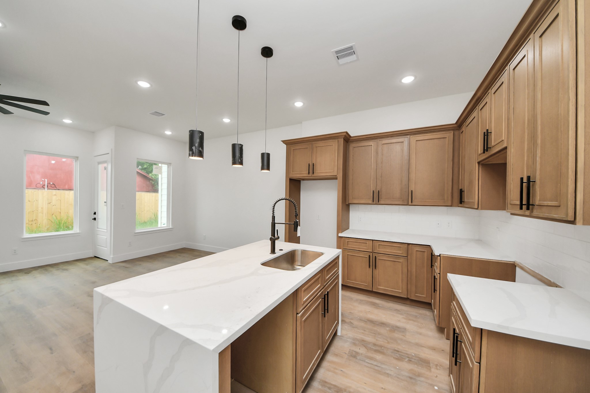 8206 Colonial Lane Houston, TX 77051 - Photo 12 of 31 a kitchen with stainless steel appliances granite countertop a sink a stove and a refrigerator