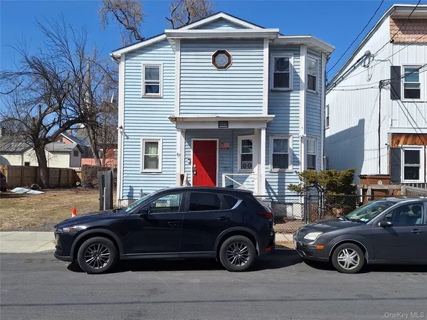 a car parked in front of a house