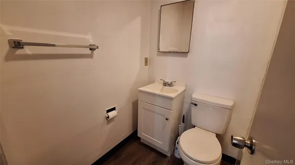 a white toilet sitting next to a bathroom sink