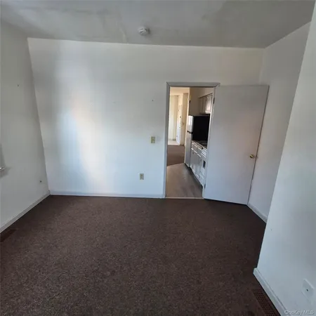 a view of a room with a hallway