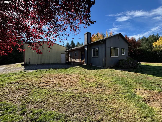 a house that has a tree in front of it