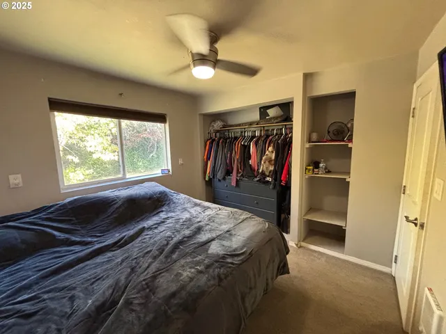 a bed room with a bed and a window