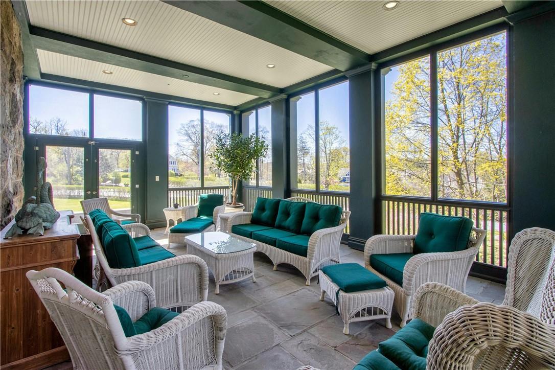 122 Circuit Road Tuxedo Park, NY 10987 - Photo 16 of 35 a living room with furniture and floor to ceiling windows