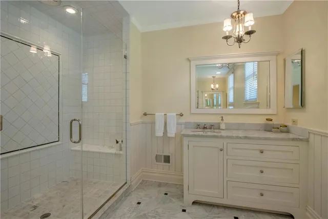 a spacious bedroom with a balcony a bed and a flat screen tv