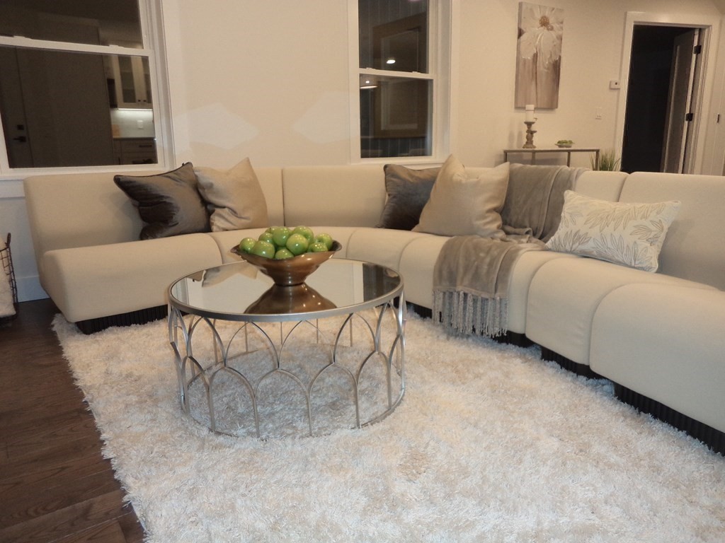 4 Wells Street Natick, MA 01760 - Photo 15 of 38 a living room with furniture and a rug