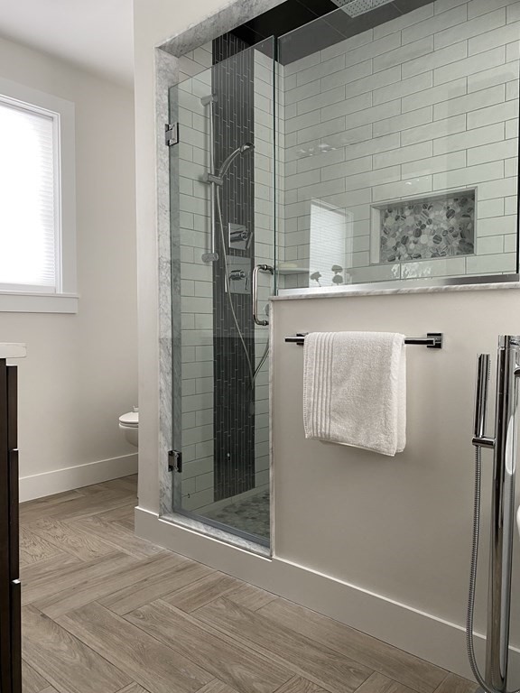 4 Wells Street Natick, MA 01760 - Photo 22 of 38 a bathroom with a shower