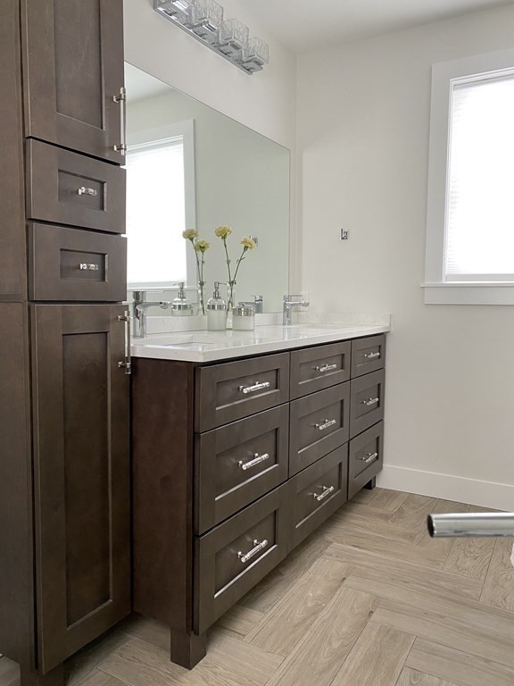 4 Wells Street Natick, MA 01760 - Photo 23 of 38 a bathroom with a granite countertop sink and a mirror
