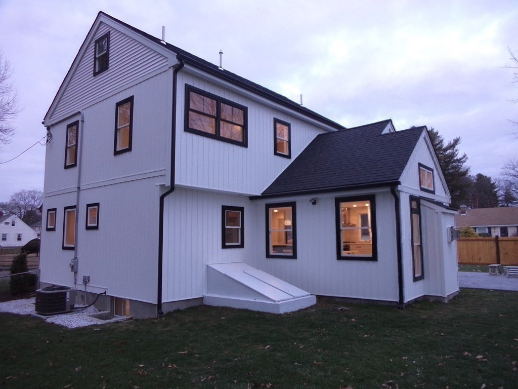 4 Wells Street Natick, MA 01760 - Photo 36 of 38 a front view of a house with a yard