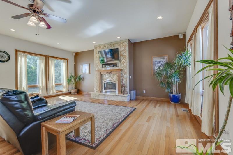 12670 Silver Wolf Road Reno, NV 89511 - Photo 12 of 25 a living room with furniture fireplace and wooden floor