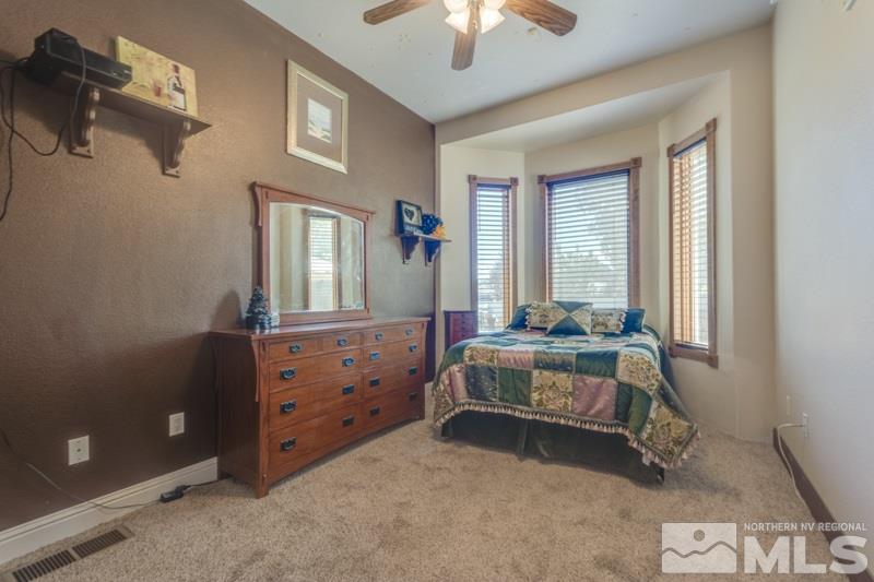 12670 Silver Wolf Road Reno, NV 89511 - Photo 19 of 25 a room with furniture and a window