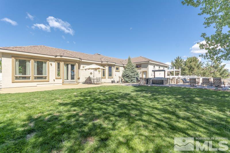 12670 Silver Wolf Road Reno, NV 89511 - Photo 25 of 25 a front view of a house with a garden