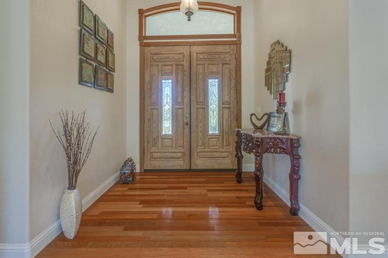 12670 Silver Wolf Road Reno, NV 89511 - Photo 4 of 25 a view of an entryway with wooden floor