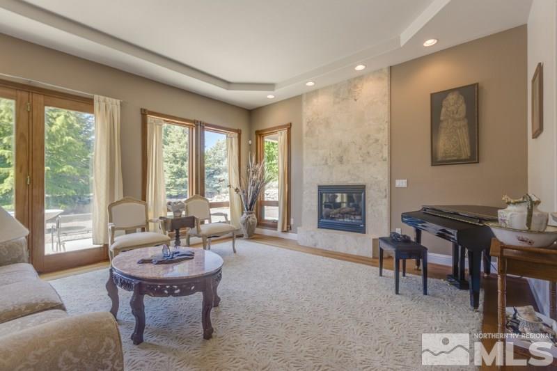 12670 Silver Wolf Road Reno, NV 89511 - Photo 5 of 25 a living room with furniture and a fireplace