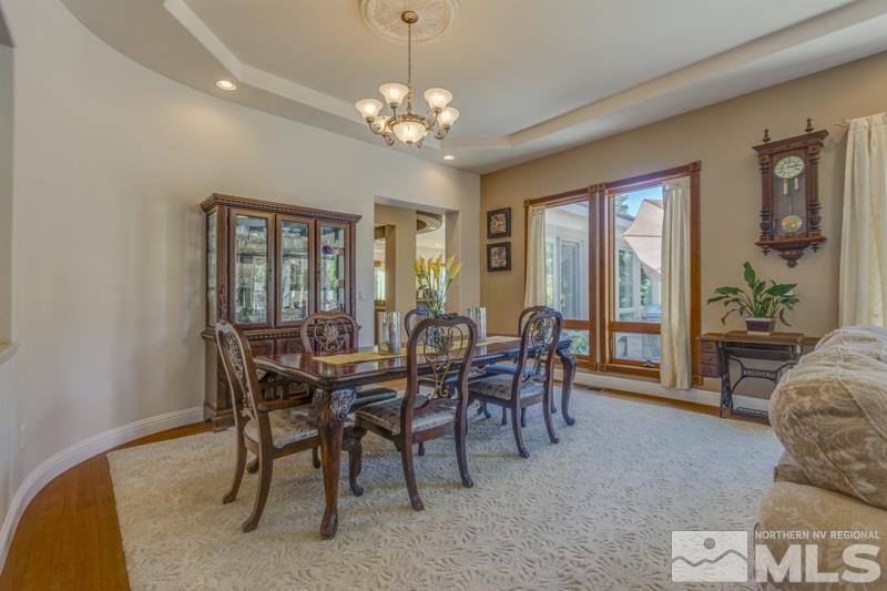 12670 Silver Wolf Road Reno, NV 89511 - Photo 6 of 25 a view of a dining room with furniture and chandelier