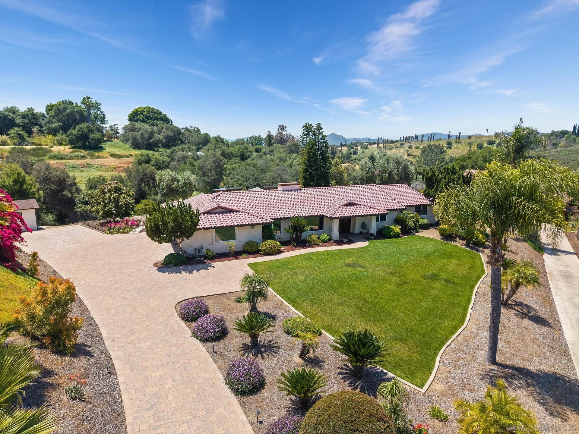1009 Summit Trail Escondido, CA 92025 - Photo 1 of 59 a view of a garden with an outdoor space