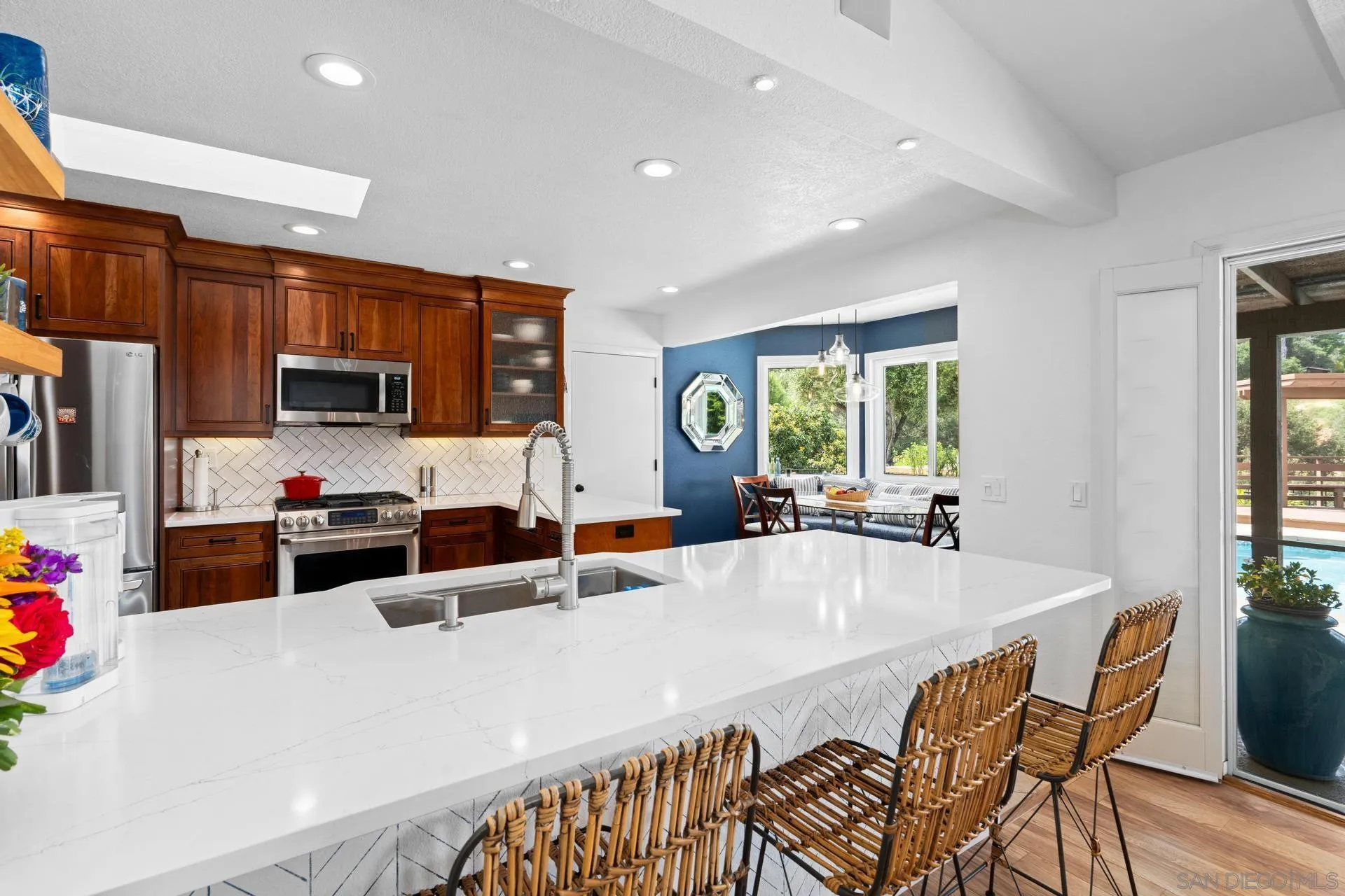 1009 Summit Trail Escondido, CA 92025 - Photo 12 of 59 a large kitchen with a table and chairs