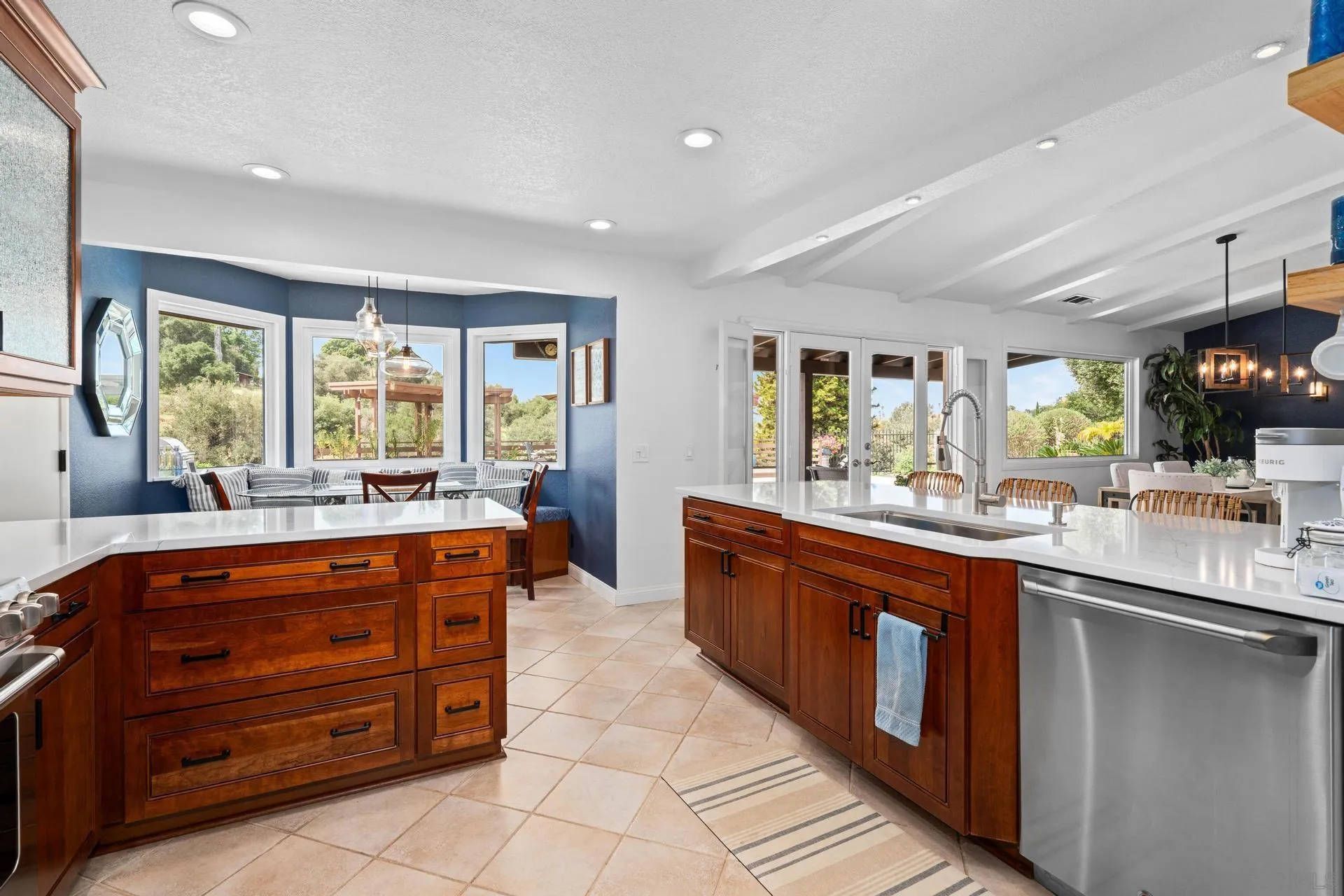 1009 Summit Trail Escondido, CA 92025 - Photo 13 of 59 a large kitchen with stainless steel appliances granite countertop a large counter top and sink