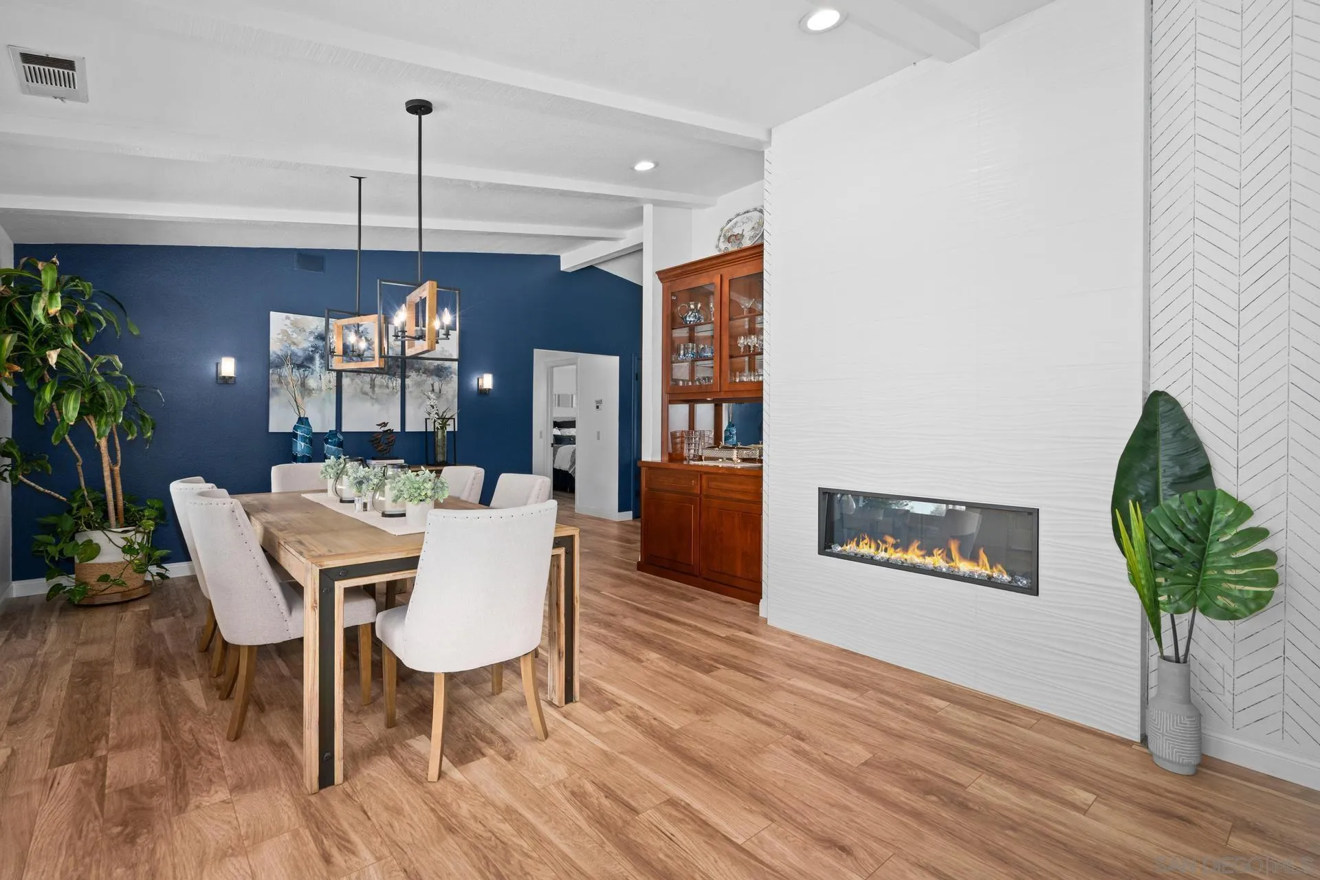 1009 Summit Trail Escondido, CA 92025 - Photo 14 of 59 a dining room with furniture a chandelier and wooden floor
