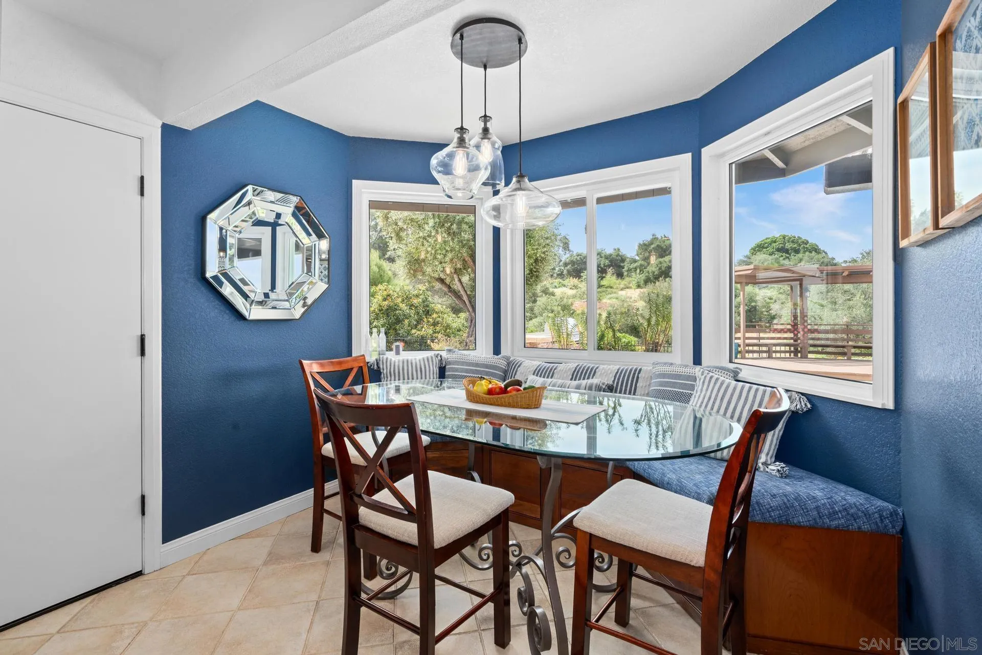 1009 Summit Trail Escondido, CA 92025 - Photo 16 of 59 a dining room with furniture a chandelier and a rug