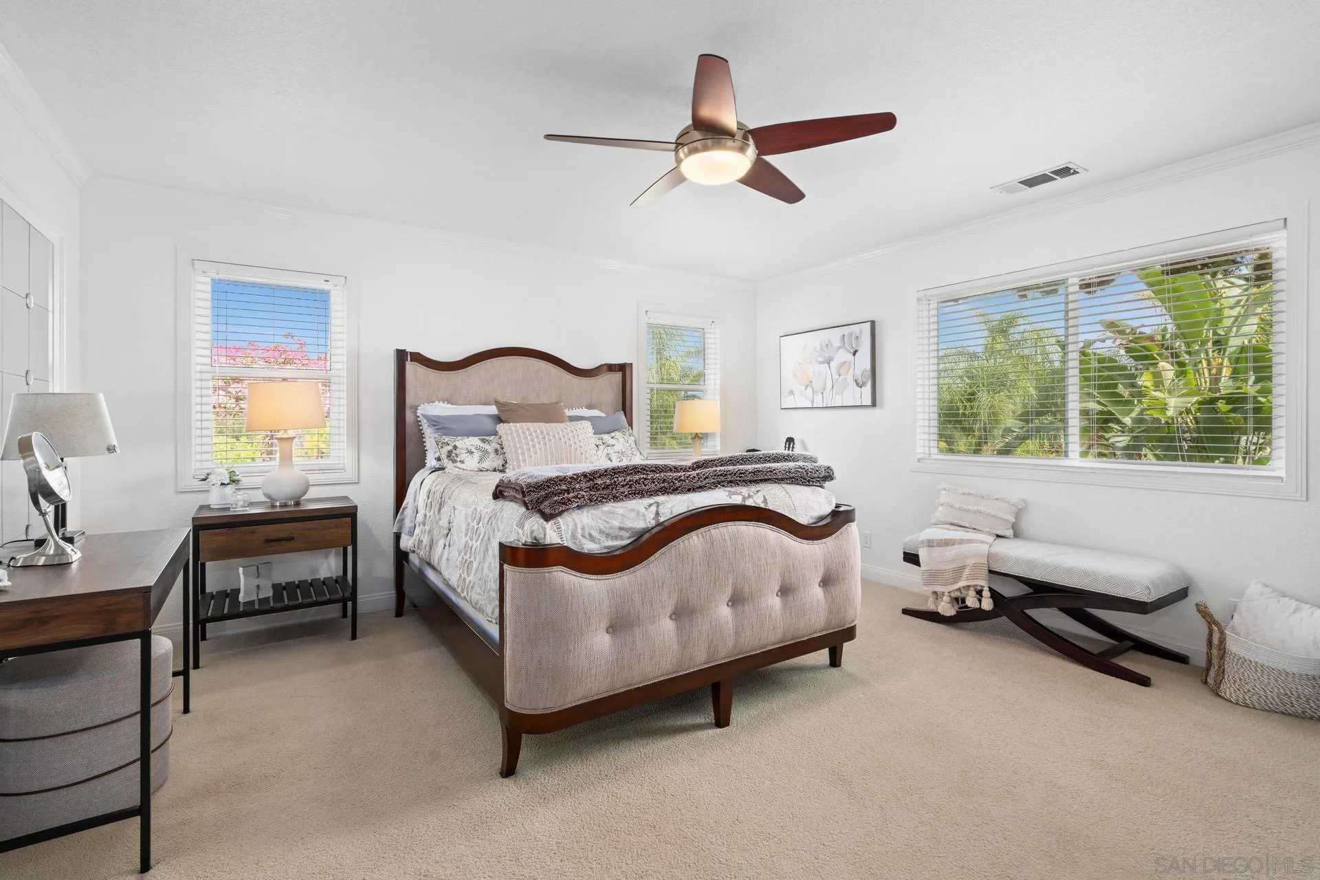 1009 Summit Trail Escondido, CA 92025 - Photo 17 of 59 a bedroom with a bed a chandelier and a window