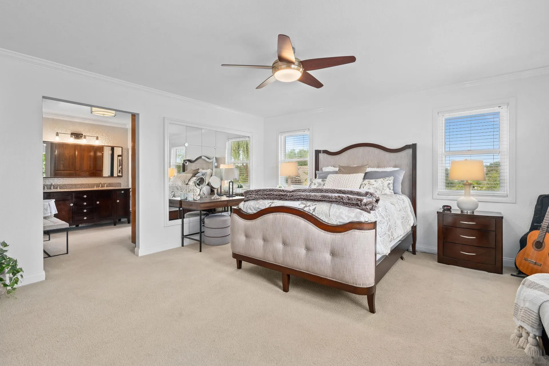 1009 Summit Trail Escondido, CA 92025 - Photo 18 of 59 a bedroom with a bed and a chandelier