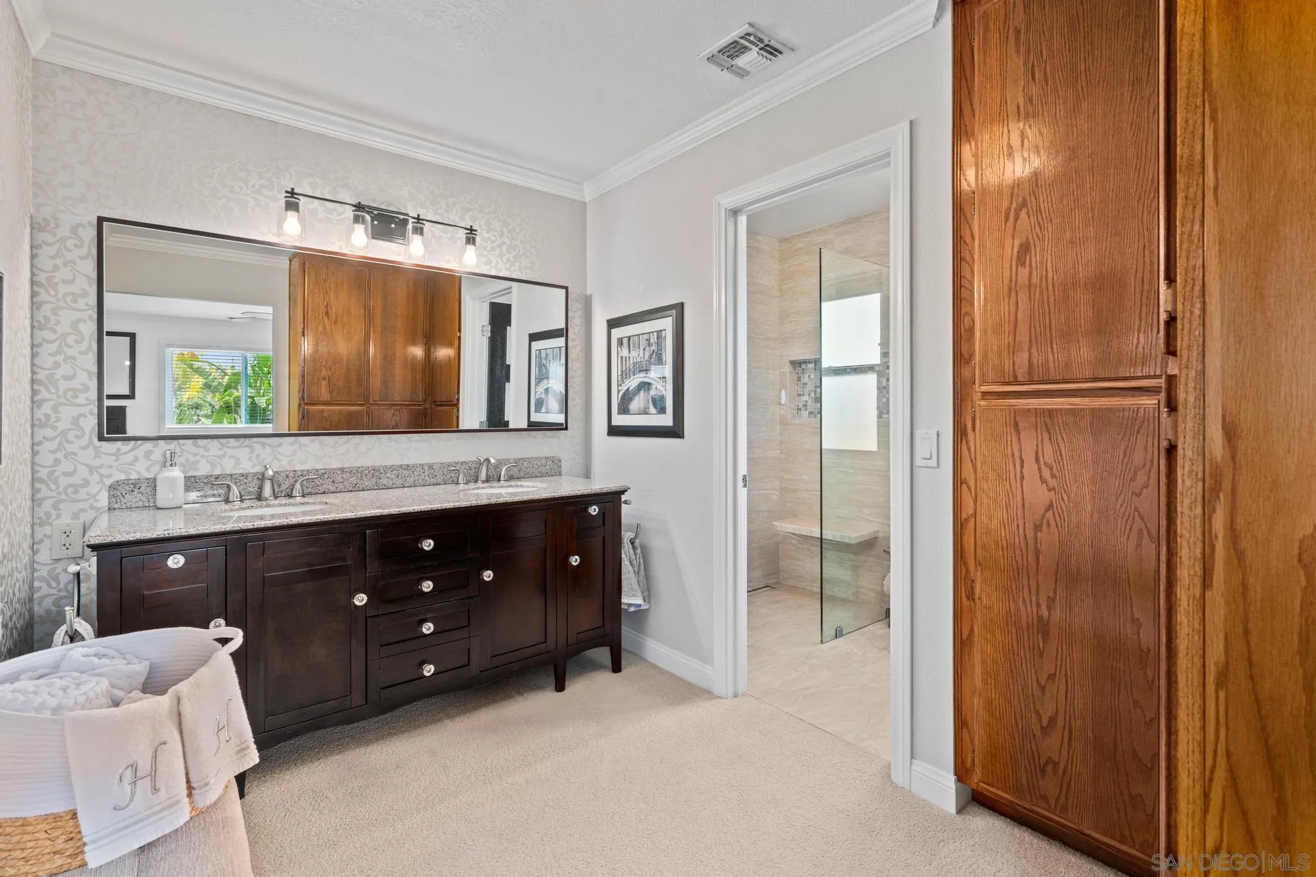 1009 Summit Trail Escondido, CA 92025 - Photo 19 of 59 a bathroom with a granite countertop sink vanity and mirror
