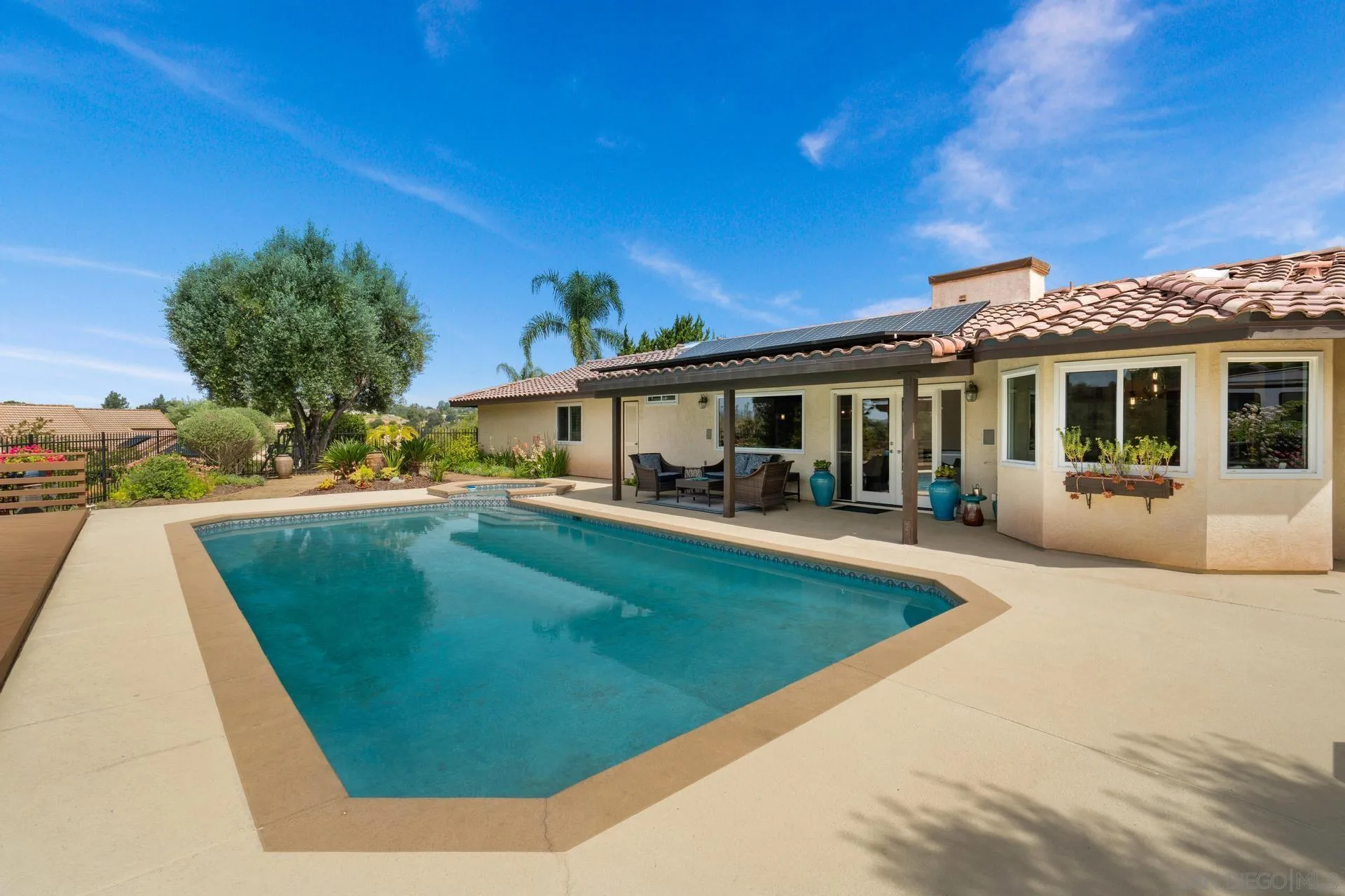 1009 Summit Trail Escondido, CA 92025 - Photo 30 of 59 a view of house with swimming pool outdoor seating