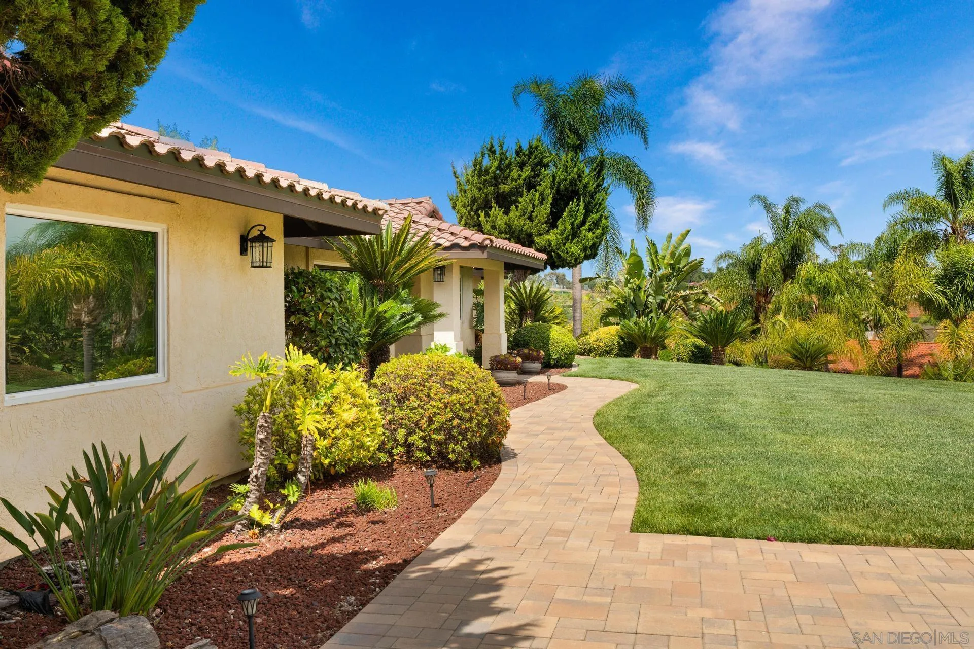 1009 Summit Trail Escondido, CA 92025 - Photo 37 of 59 a front view of a house with a yard